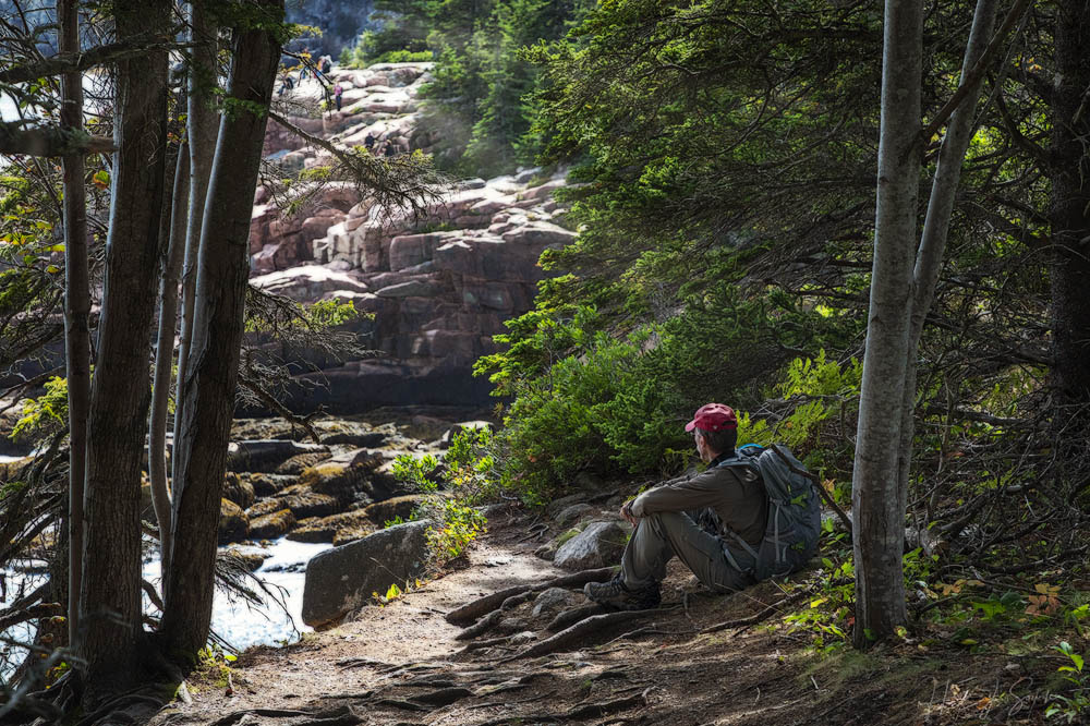 2018_09_Maine-10476-Edit1000.jpg - I was dawdling along trying to take pictures of the changing leaves (and failing, it was too windy) so Mike walked ahead and found a place in the shade to wait for me.